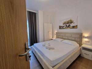 Postel nebo postele na pokoji v ubytování Hotel Queen Margaret Seaside