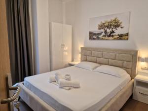 Postel nebo postele na pokoji v ubytování Hotel Queen Margaret Seaside