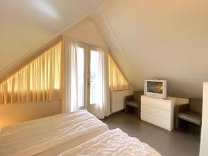 Postel nebo postele na pokoji v ubytování Previnaireweg 22