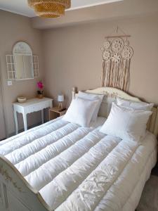 Postel nebo postele na pokoji v ubytování Chambre privée