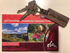 a pair of keys sitting on top of a flyer at Altes Uhrwerk in Hasselfelde
