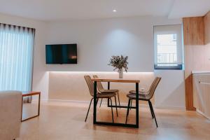 Apartamentos Santa Isabel的电视和/或娱乐中心