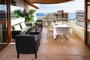 a balcony with a table and chairs and a view at Mar de Alborán Center sea view in Marbella