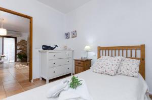 Postel nebo postele na pokoji v ubytování Cas Pati (Son Moja)