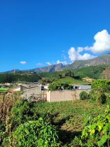 a view of the mountains from a farm at Casa Montanhas do Caparaó in Caparaó Velho