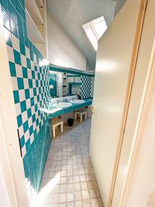 a bathroom with two sinks and a mirror at Casa di Gio in Malgrate