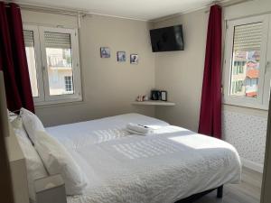 Postel nebo postele na pokoji v ubytování Hôtel Oxo