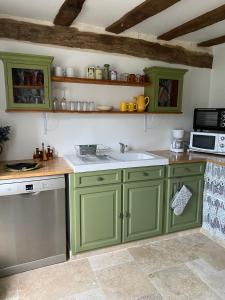 Dapur atau dapur kecil di Gîte de charme "Tellement Bien" proche zoo de Beauval et châteaux de la Loire