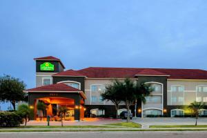 a hotel with a sign on the front of it at La Quinta by Wyndham Mission at West McAllen in Mission
