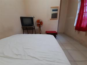 מיטה או מיטות בחדר ב-SPOT ON 92492 Pelita Satu