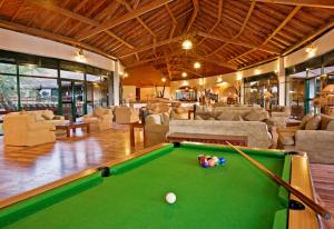 a pool table in a living room with a pool table at Tarangire Sopa Lodge in Madege