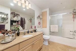 a bathroom with a sink and a toilet and a shower at Luxury condo near Irvine Business & UCI Hospital in Irvine