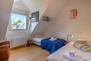 Posteľ alebo postele v izbe v ubytovaní Ker Anna - Maison proche plage pour 7