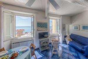 a living room with a view of the ocean at Beach House Camogli in Camogli