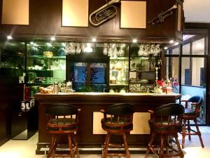 a bar with chairs and a counter in a restaurant at Eco Resort Beverly Hills in Ipoh