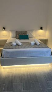 Postel nebo postele na pokoji v ubytování Juli’s Suites