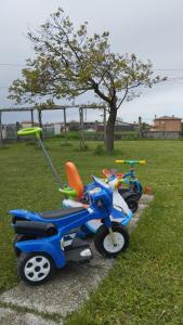a group of toy motorcycles parked in a field at Mansarda al mare in Pertegada