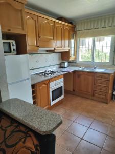 A kitchen or kitchenette at Aldeas De Aguamarina Phase I