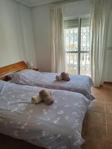 A bed or beds in a room at Aldeas De Aguamarina Phase I Még 4 kép