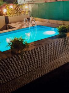 a large swimming pool with at Ivy Little Door Cottage, Compact AC 3 BHK with Pool, Lonavala in Lonavala