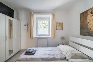Posteľ alebo postele v izbe v ubytovaní Modernes Appartement nahe U-Bahn und Schönbrunn