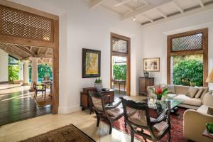 a living room with a table and chairs at Taru Villas Rampart Street - Galle Fort in Galle