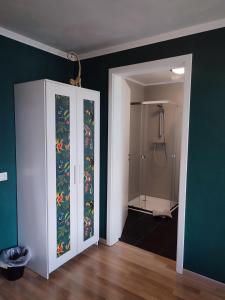 a bathroom with a shower and a glass door at Hotel Groote Engel in Emlichheim +39 photos