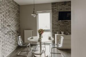 Telewizja i/lub zestaw kina domowego w obiekcie Łódź Fabryczna Apartament
