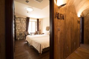 Katil atau katil-katil dalam bilik di Boutique Hotel Astoria