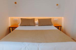 Apartamentos Santa Isabel客房内的一张或多张床位