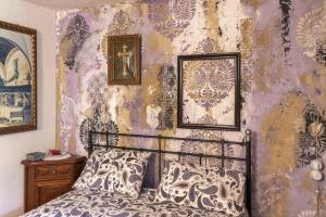 Postel nebo postele na pokoji v ubytování Maison Enchantée