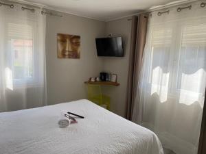 Postel nebo postele na pokoji v ubytování Hôtel Oxo