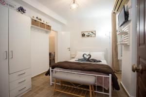 A bed or beds in a room at Akis studio Liston square area Corfu