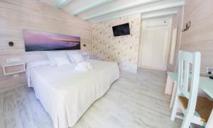Postel nebo postele na pokoji v ubytování Hotel La Torre