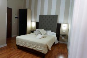 Postel nebo postele na pokoji v ubytování Hotel Sant'Elia