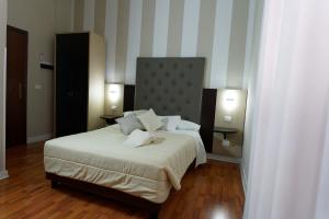 Postel nebo postele na pokoji v ubytování Hotel Sant'Elia