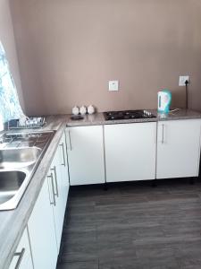 Kuchyň nebo kuchyňský kout v ubytování NAMU Apartments