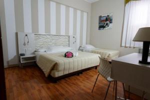 Postel nebo postele na pokoji v ubytování Hotel Sant'Elia