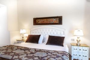 A bed or beds in a room at Residenza le Colline del Paradiso
