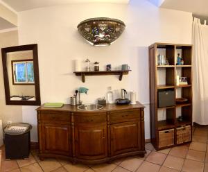 a bathroom with a sink and a mirror at La Galería in Calera +65 photos