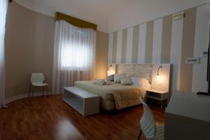 Postel nebo postele na pokoji v ubytování Hotel Sant'Elia