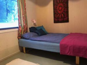 Ένα ή περισσότερα κρεβάτια σε δωμάτιο στο Charming house in fjord Lofoten