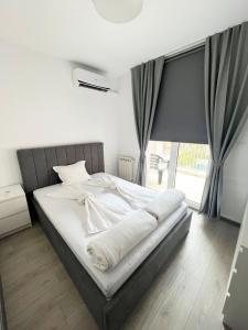 Кровать или кровати в номере Lubata 5 Apartments