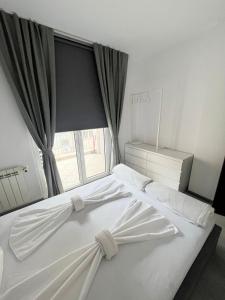 Lubata 5 Apartments tesisinde bir odada yatak veya yataklar