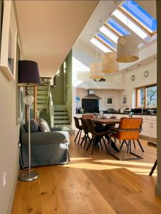 a living room with a couch and a table at Barleycove Villa, Goleen, West Cork in Goleen