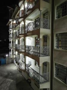 a building with balconies on the side of it at SAFNEST Furnished Apartment in Nakuru