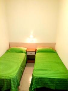Кровать или кровати в номере Residence Palm Garden