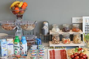 a table with food and other food items in jars at Pansion Leggero in Krk