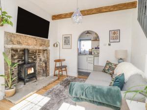 a living room with a fireplace and a couch at 4 Pulmans Place in Halifax