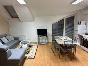 A television and/or entertainment centre at Kondé Apartments A